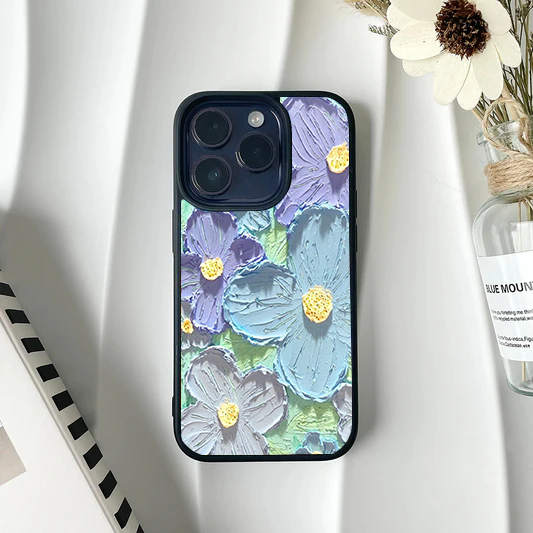 Phone case featuring a textured impasto painting design of large pale blue and lavender flowers.